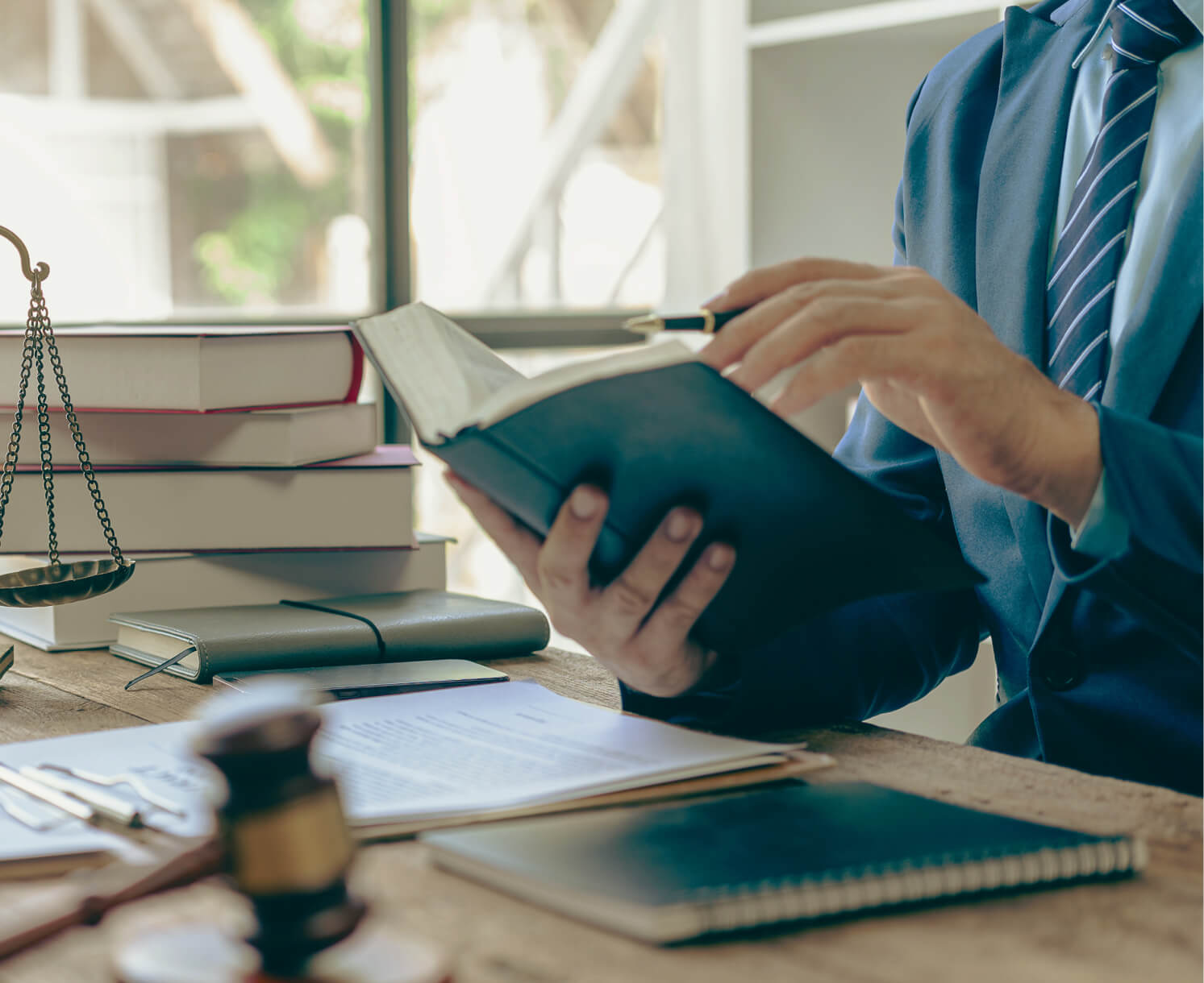two people at a table signing documents